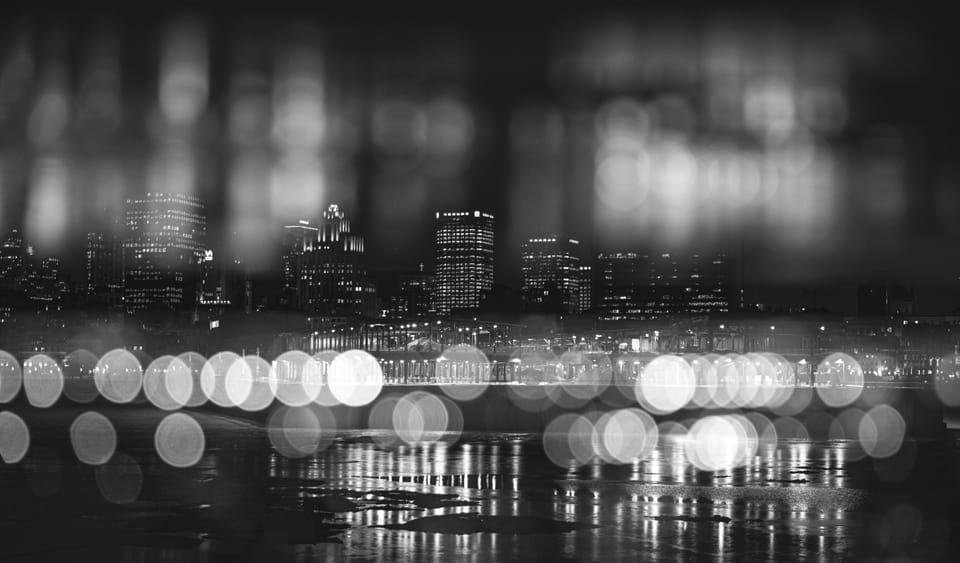 An unfocused skyline of big city in the night.